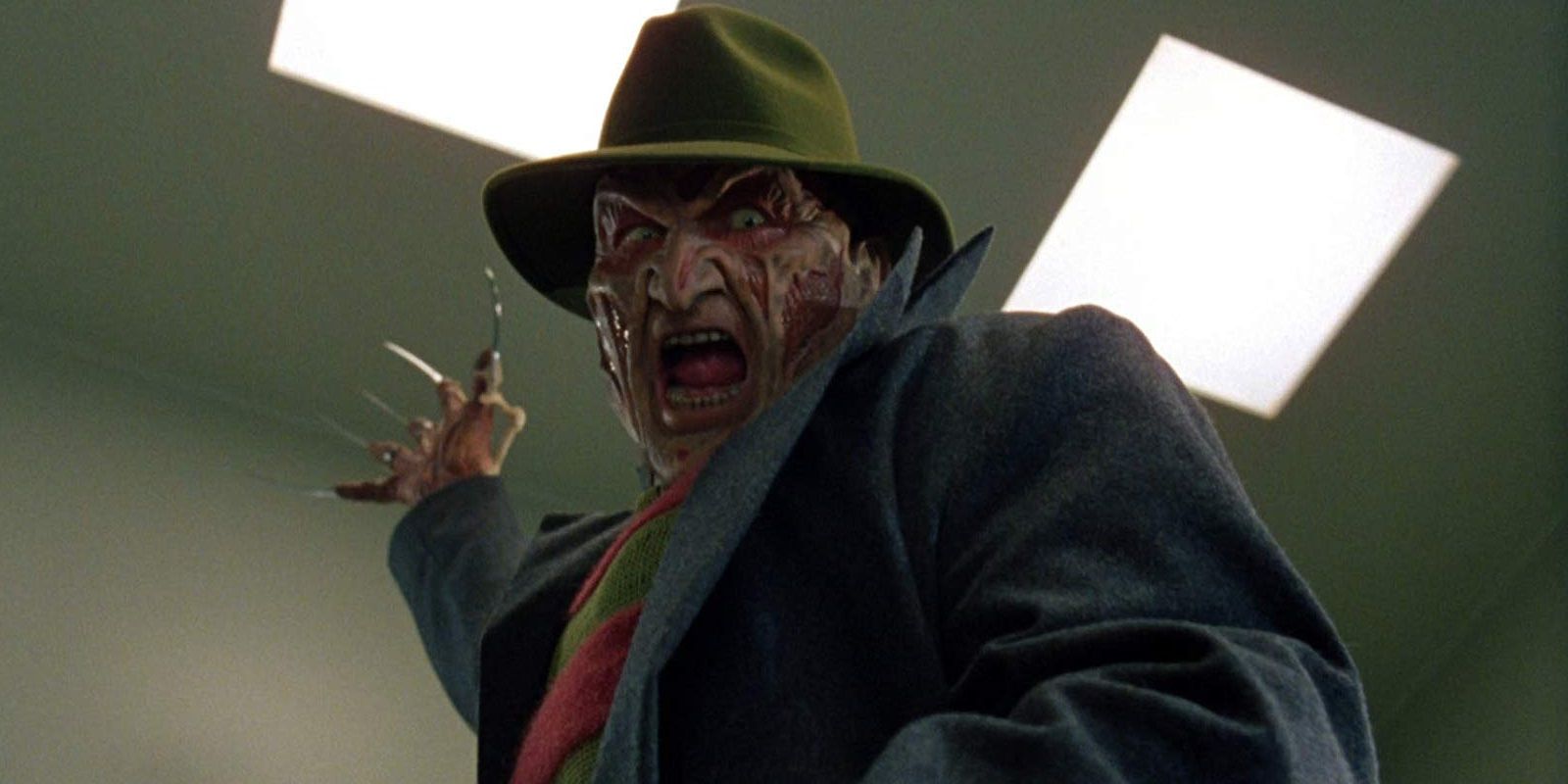 Freddy Krueger raising his blade glove in Wes Craven's New Nightmare