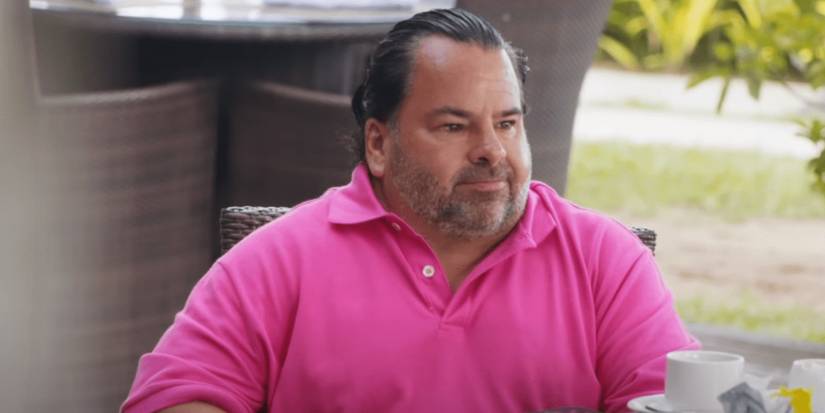 Big Ed Brown from 90 Day Fiancé: Before the 90 Days wearing pink shirt looking sad