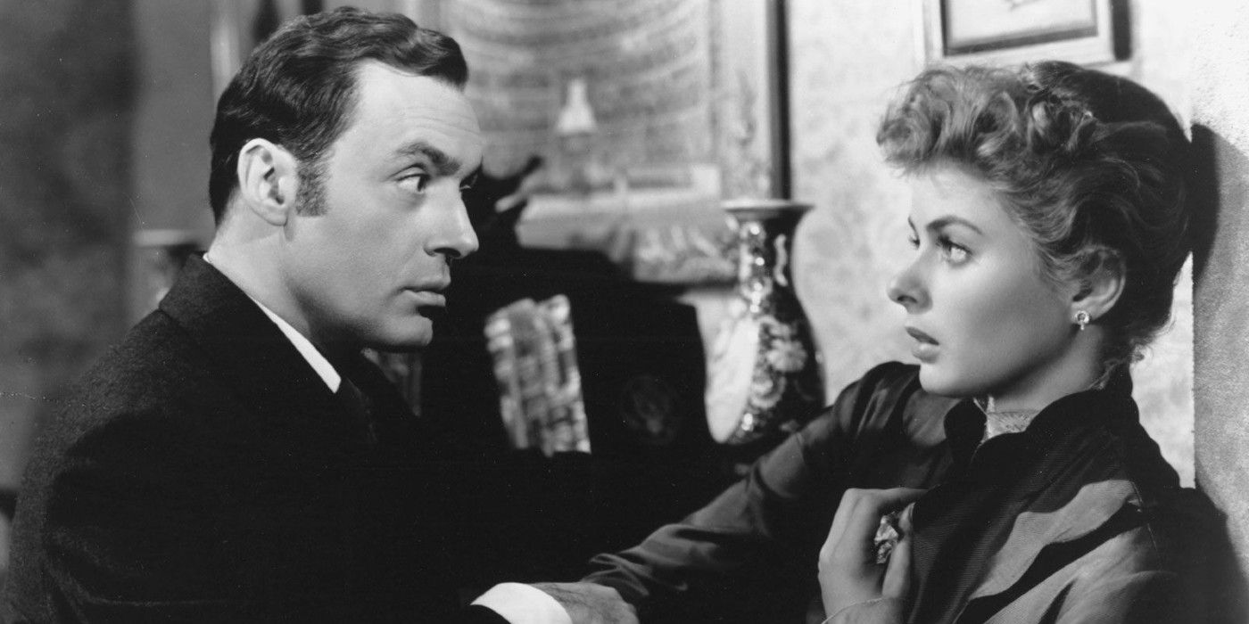 A man looks intently at a scared woman in Gaslight