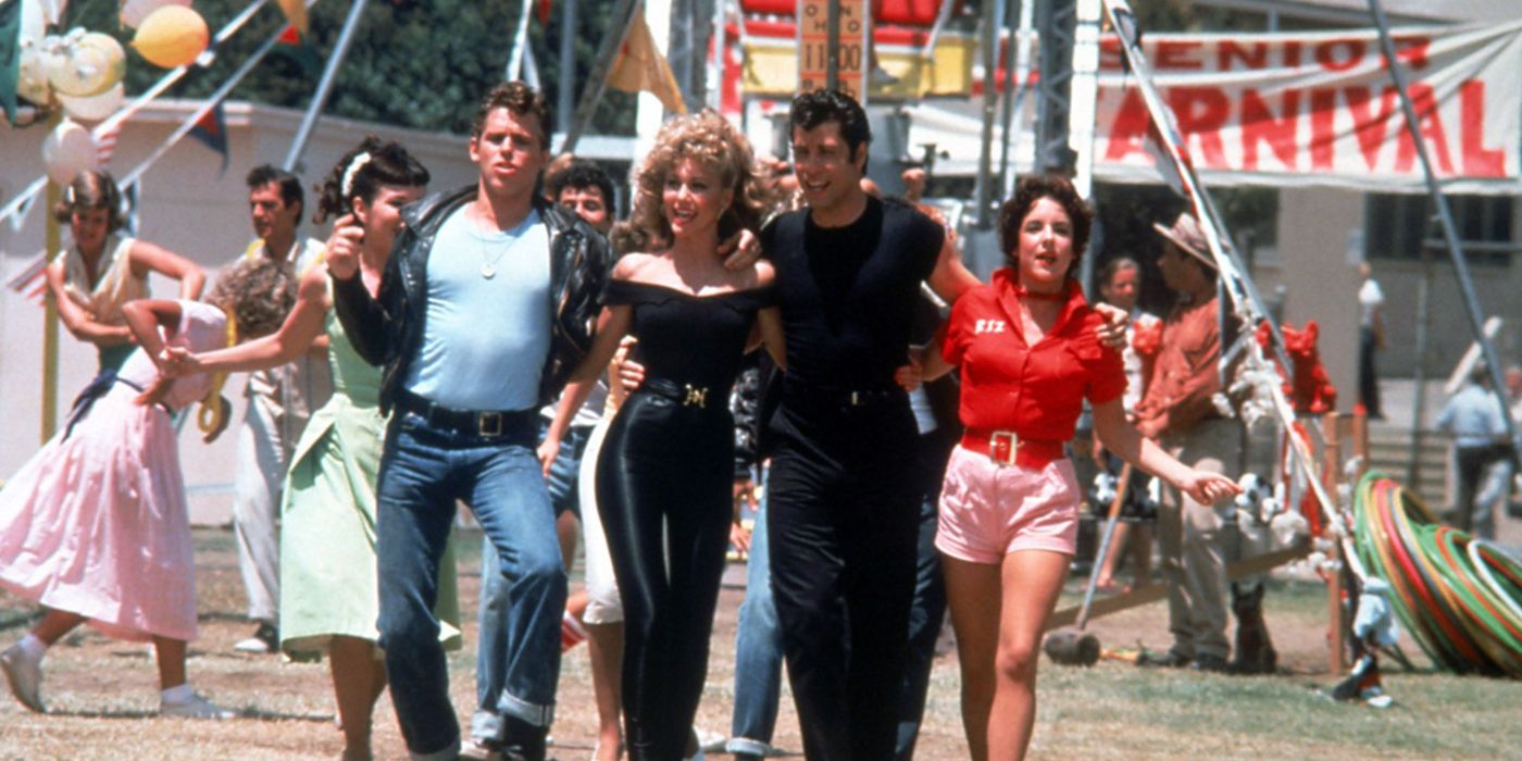 The T-Birds and Pink Ladies walk through the carnival and dance in the end of Grease