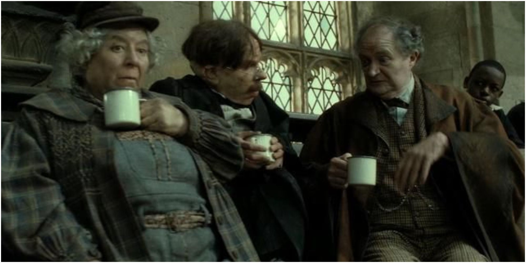 A screenshot of Professors Pomona Sprout, Filius Flitwick and Horace Slughorn chatting from Harry Potter and the Deathly Hallows Part 2