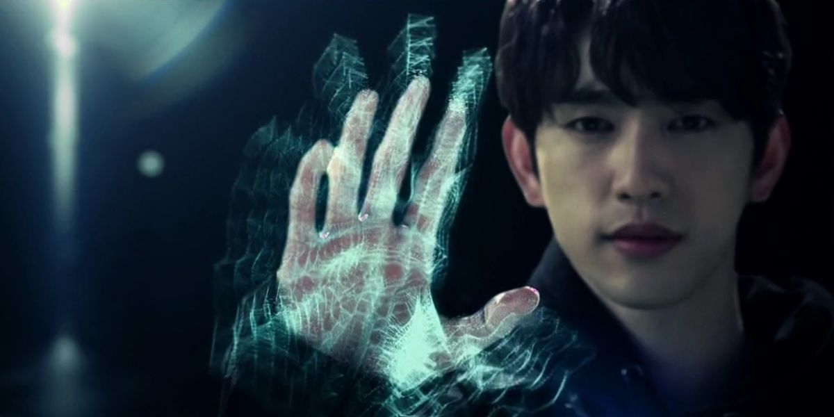 Ahn holding up his hand using his powers in He is Psychometric