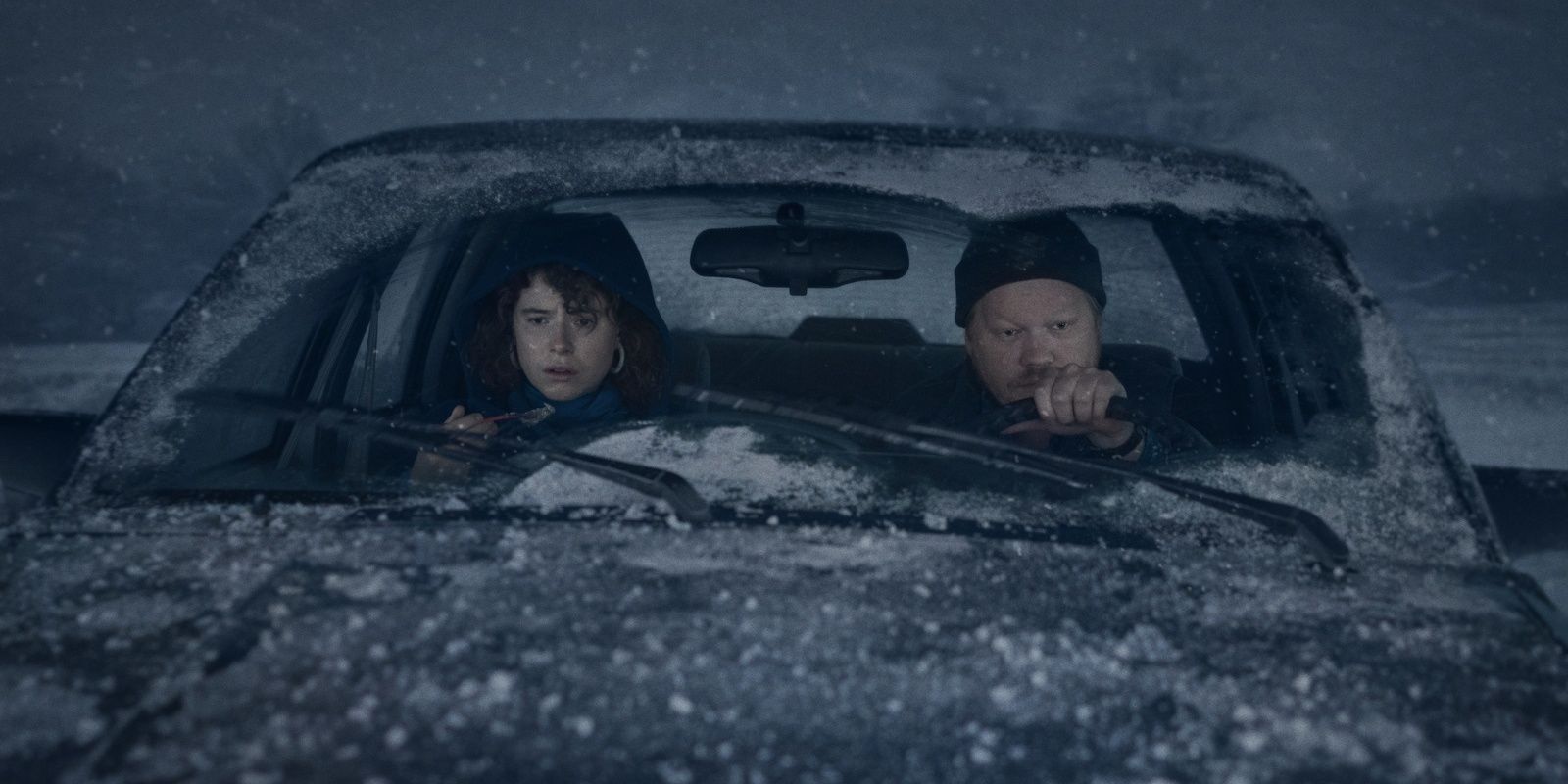 Jesse Plemons and Jessie Buckley Driving Through The Snow in a still from I'm Thinking of Ending Things.