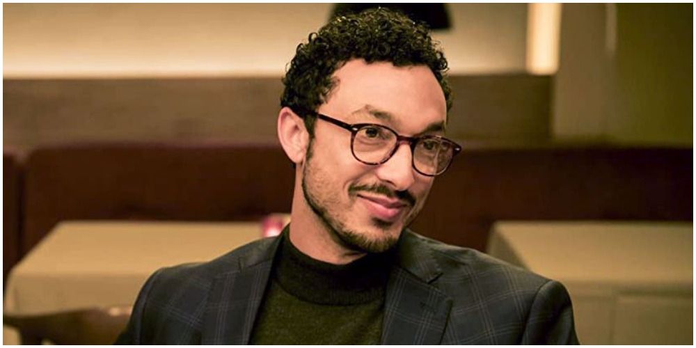 Derek with glasses, turtleneck, jacket