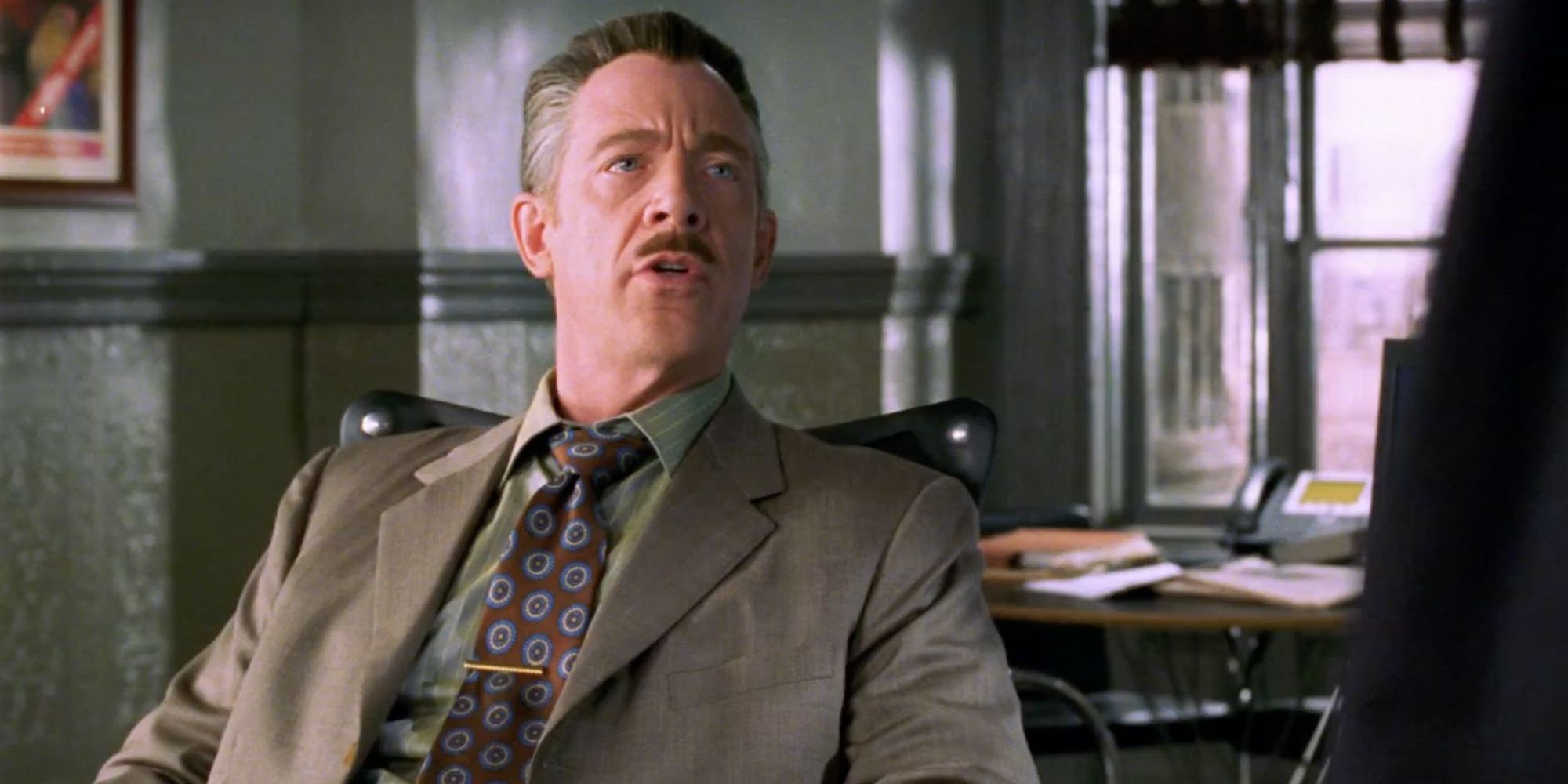 Jameson sitting at his desk in Spider-Man 2