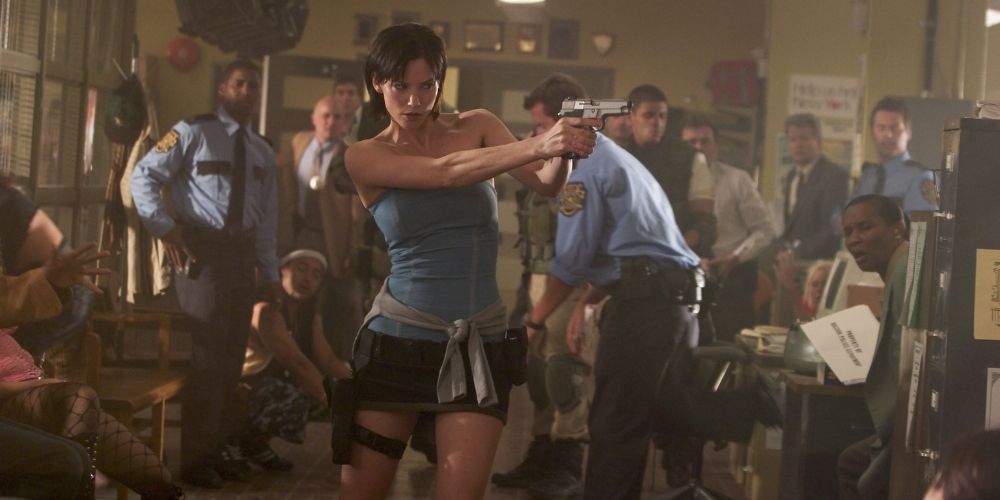 An image of Jill Valentine holding a gun at zombies