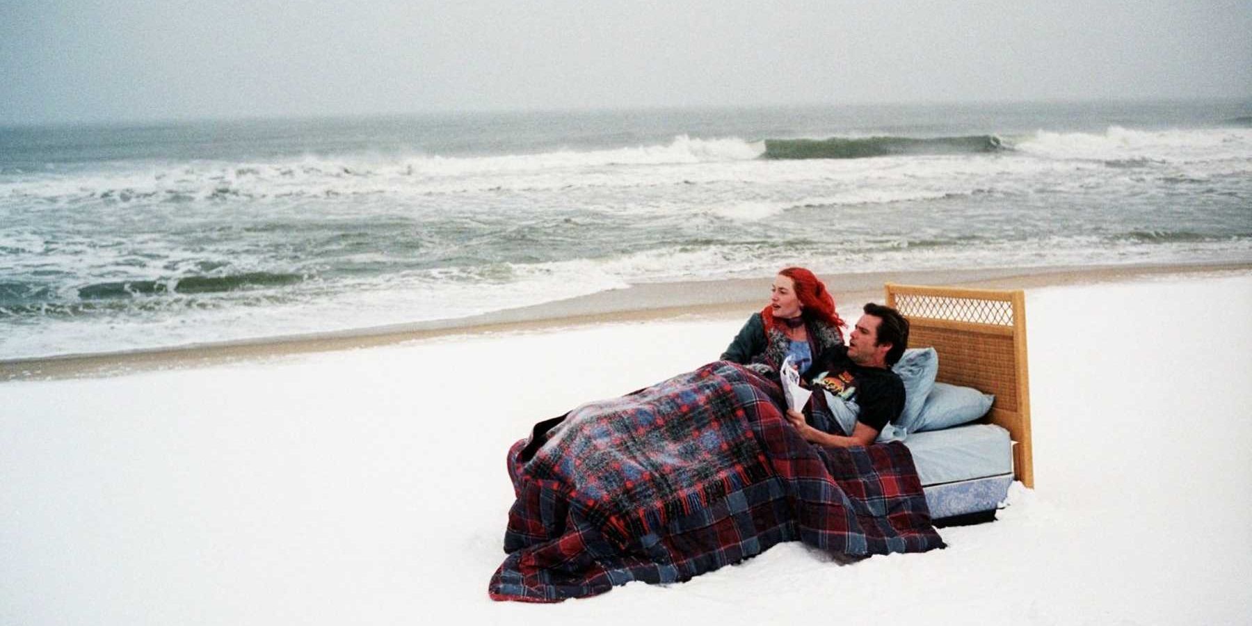 Joel and Clementine in bed on a beach