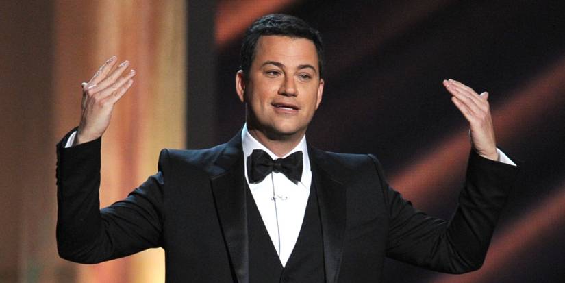 Jimmy Kimmel raising his hands as he hosts the Emmys.