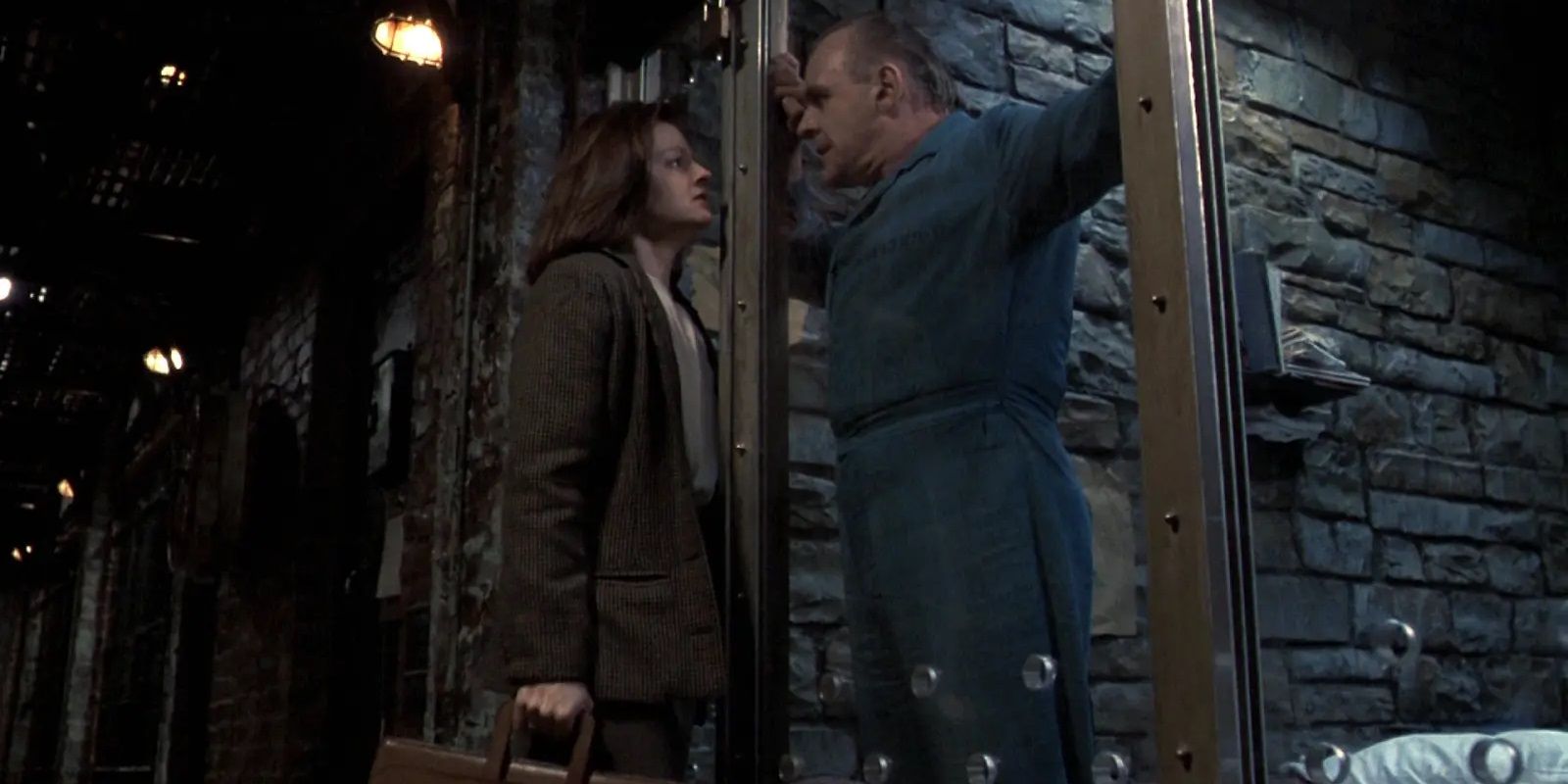 Jodie Foster and Anthony Hopkins speaking through a glass wall in The Silence of the Lambs