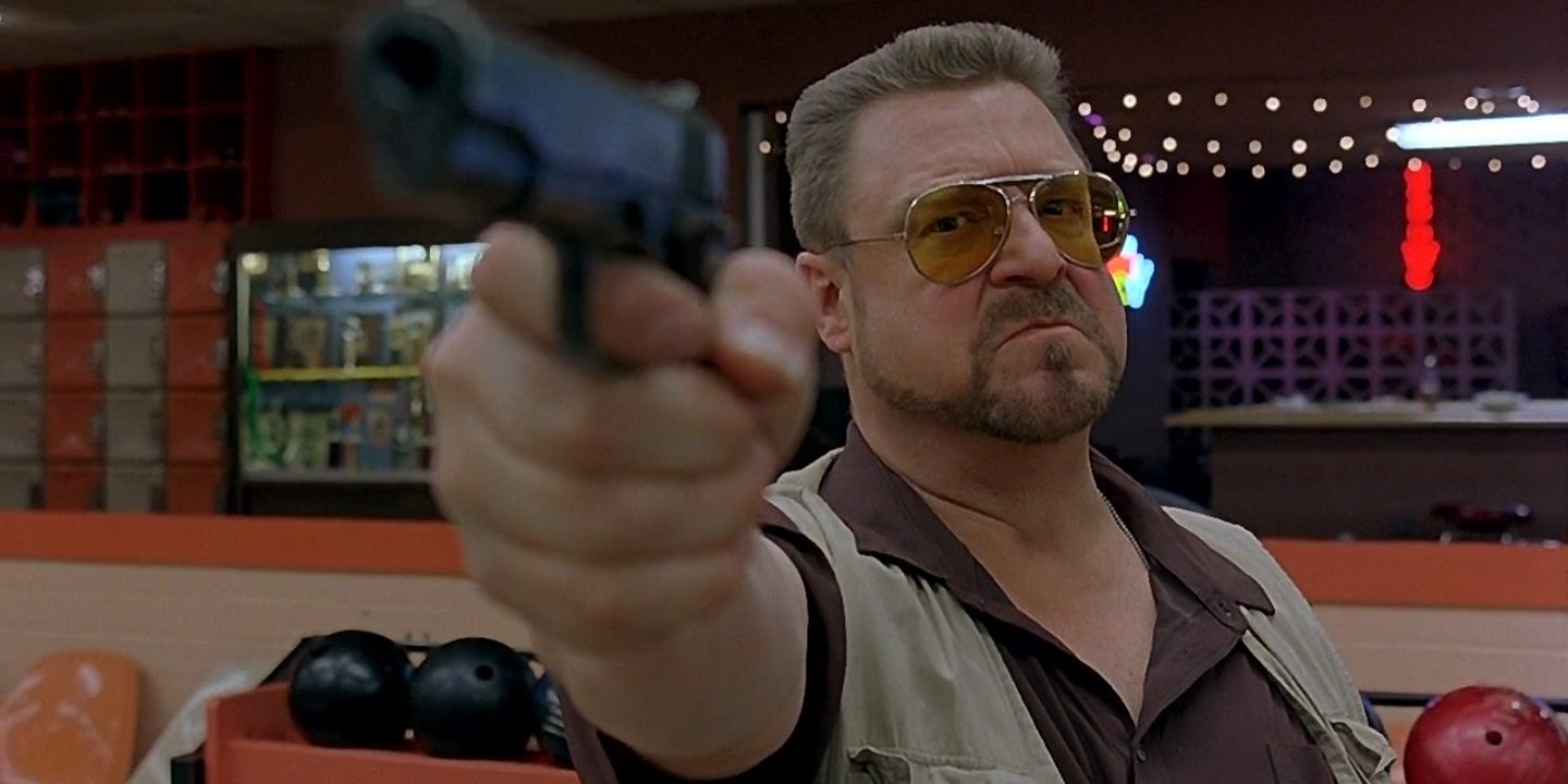John Goodman holding a gun in The Big Lebowski