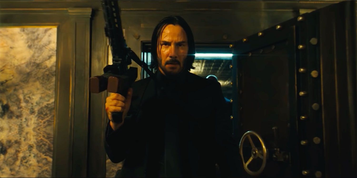 Keanu Reeves holding a big gun in John Wick 3