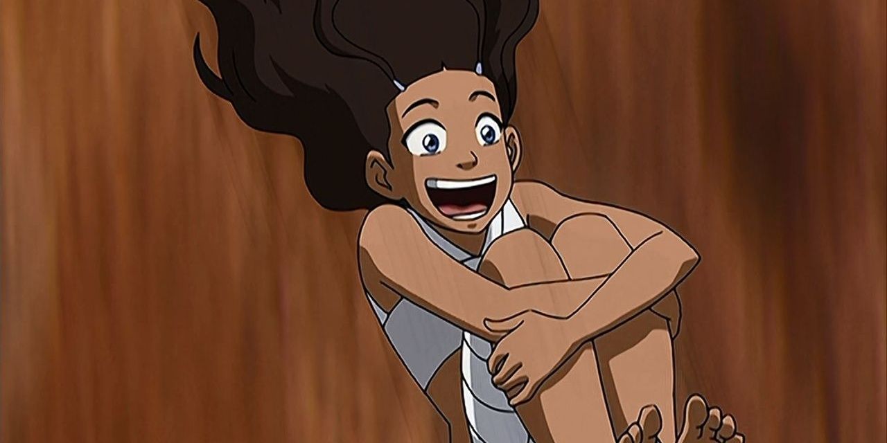 Katara hugs herself as she falls in Avatar: The Last Airbender.
