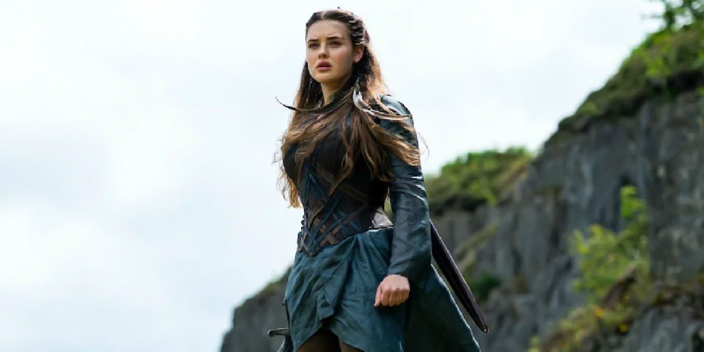 Katherine Langford as Nimue standing in the outdoors in Cursed