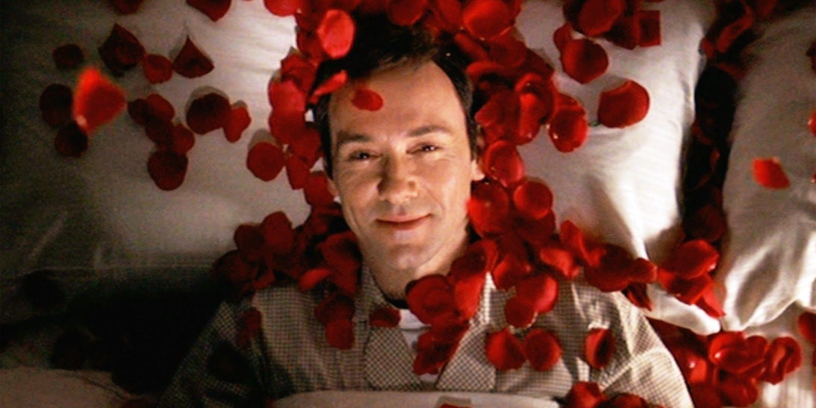 Kevin Spacey with rose pedals falling on him in American Beauty