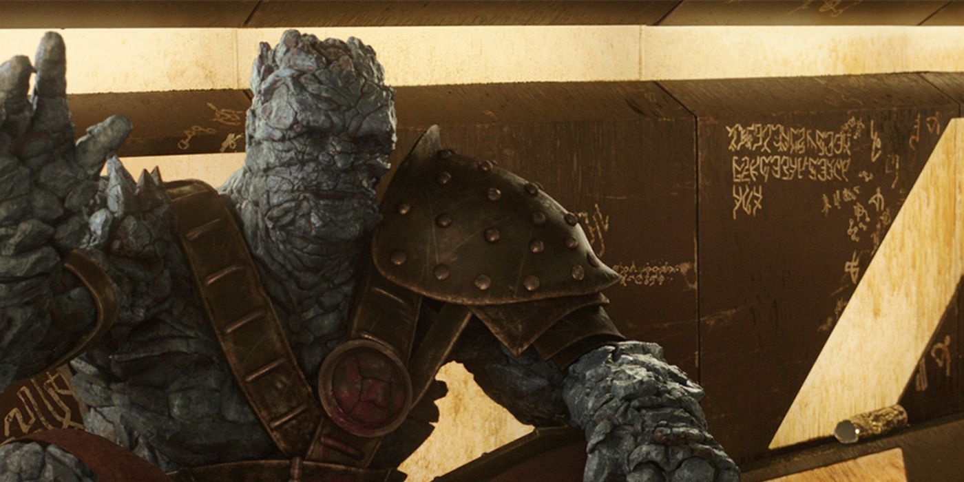 A seated Korg waving to Thor in Thor: Ragnarok.