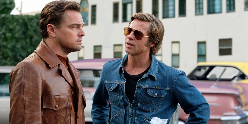 Leonardo DiCaprio and Brad Pitt in a parking lot In Once Upon A Time In Hollywood