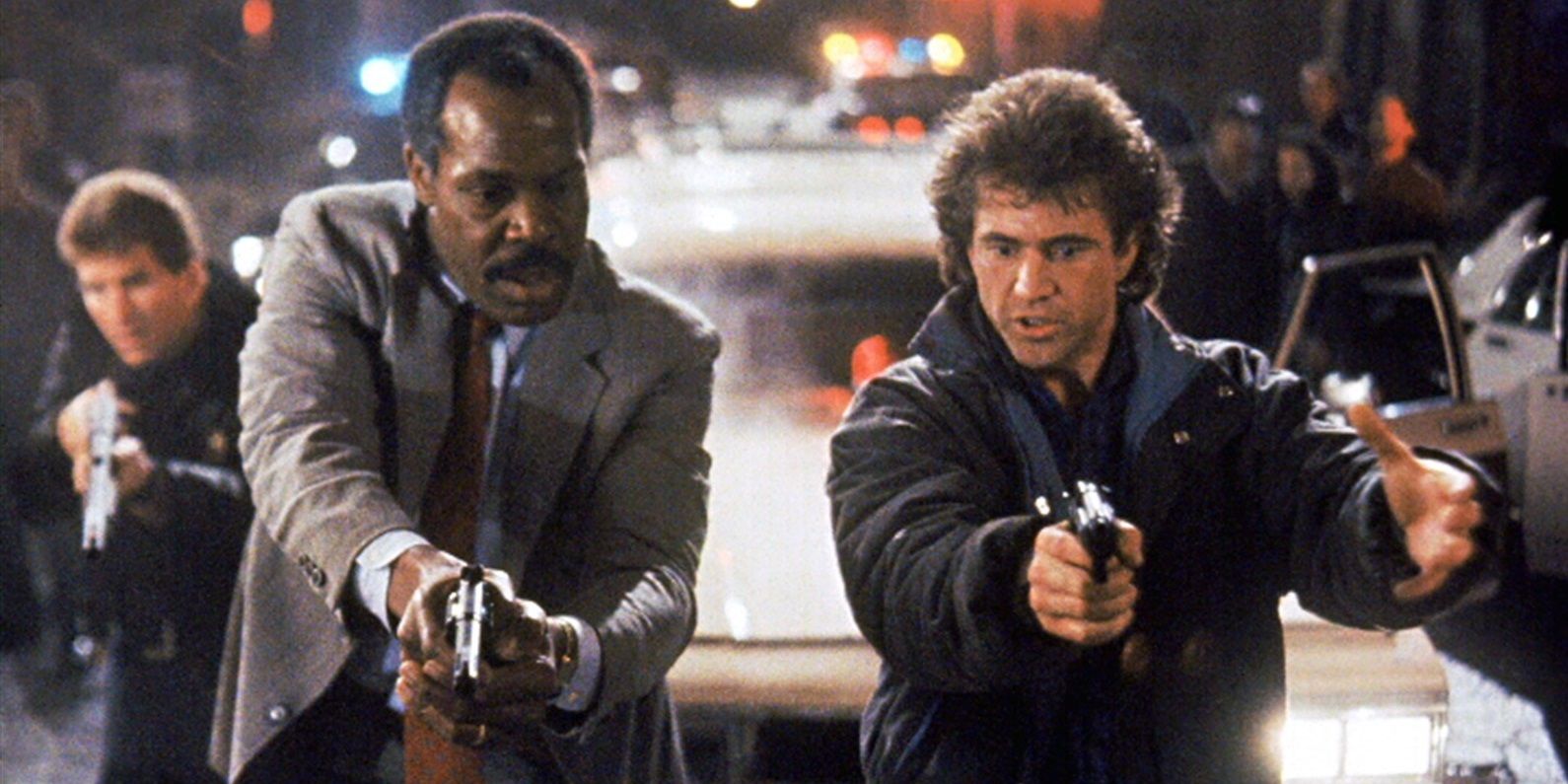 Riggs and Murtaugh with their guns drawn in Lethal Weapon 2