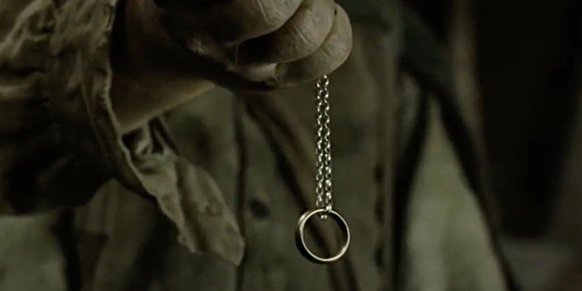 Sam holding the One Ring in The Lord of the Rings.