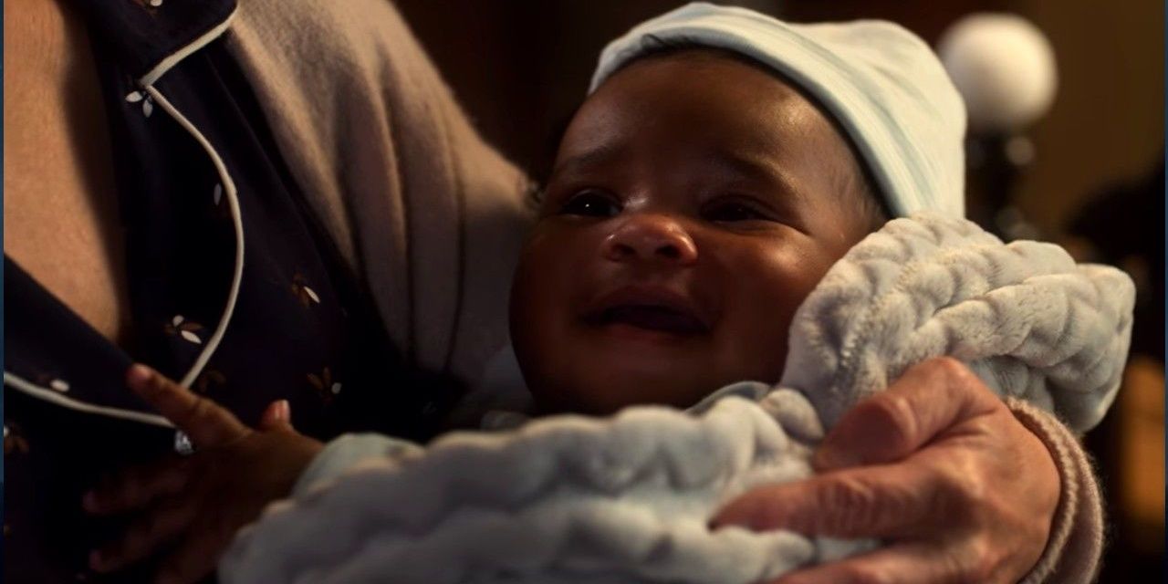 A close up of a swaddled baby Charlie from Lucifer.