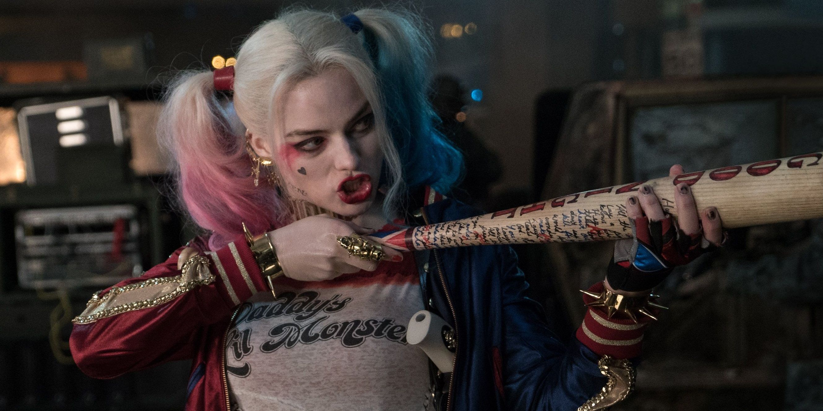 Margot Robbie as Harley Quinn pointing her bat like a gun in Suicide Squad