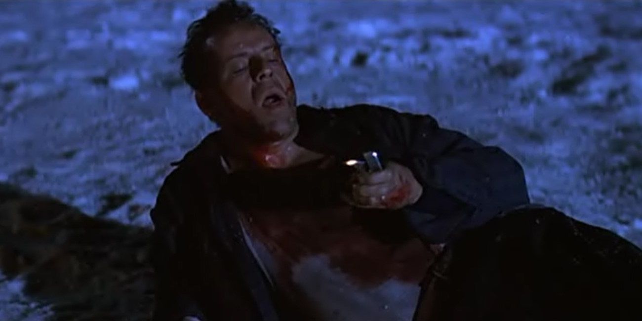 McClane lying in the snow with a lighter in Die Hard 2