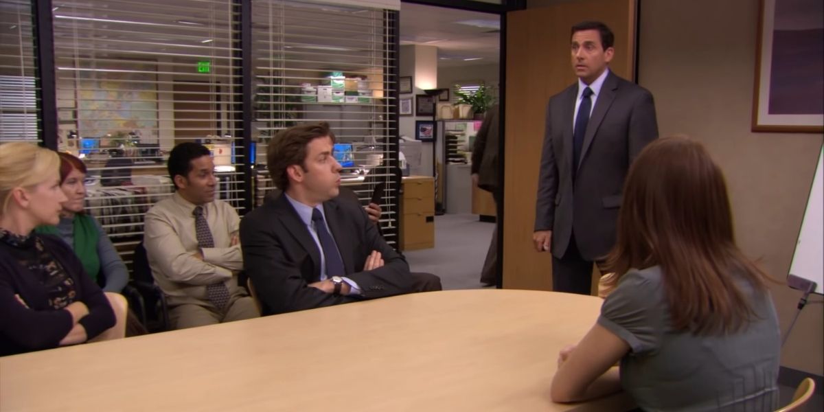 Michael Scott and co-workers in meeting room