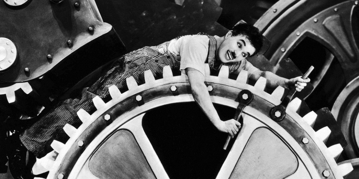 Charlie Chaplin lying on a giant gear in Modern Times