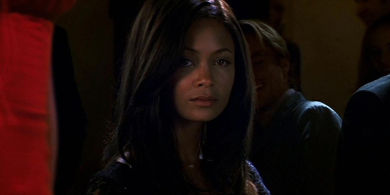 Nyah gazes at Ethan from across the room in the 2000 film Mission Impossible II.