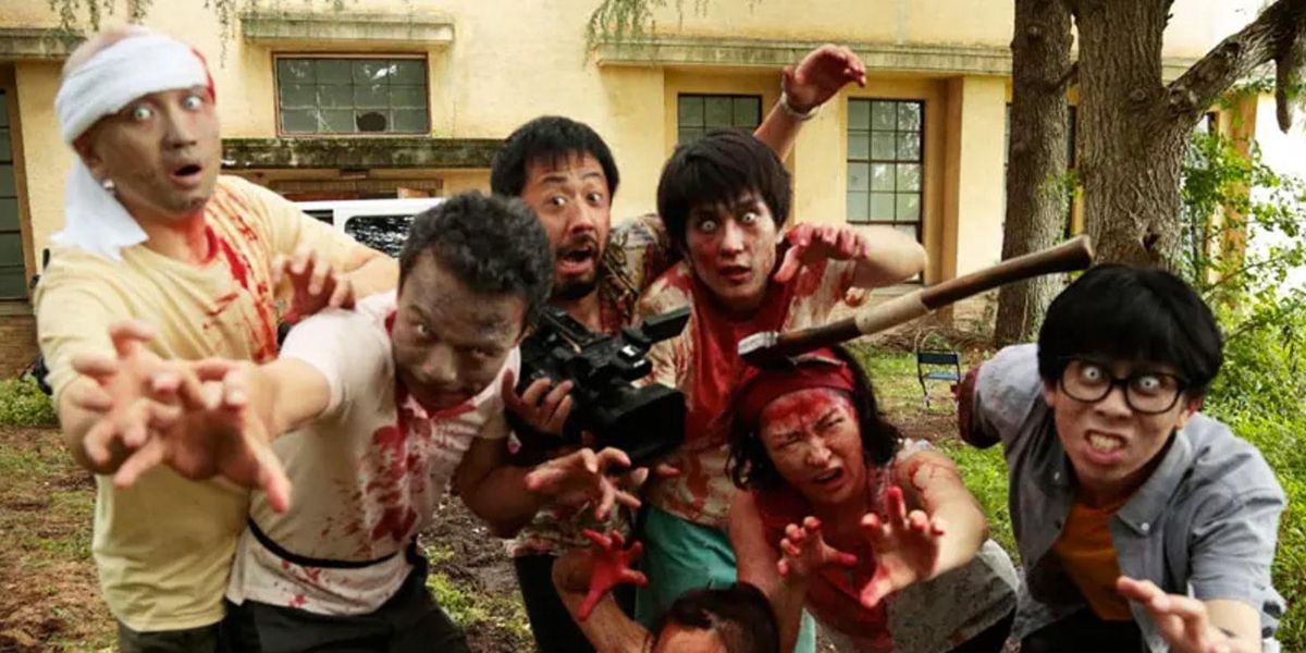 Fake zombies reach towards the camera in One Cut Of The Dead