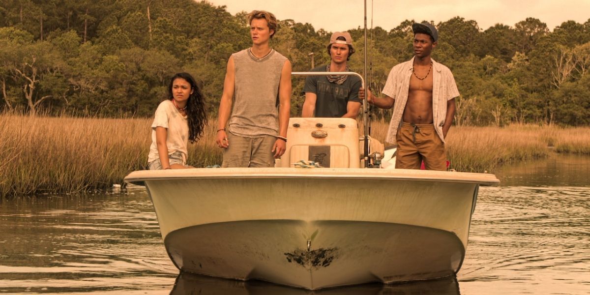 Original cast of Netflix's Outer Banks on a boat