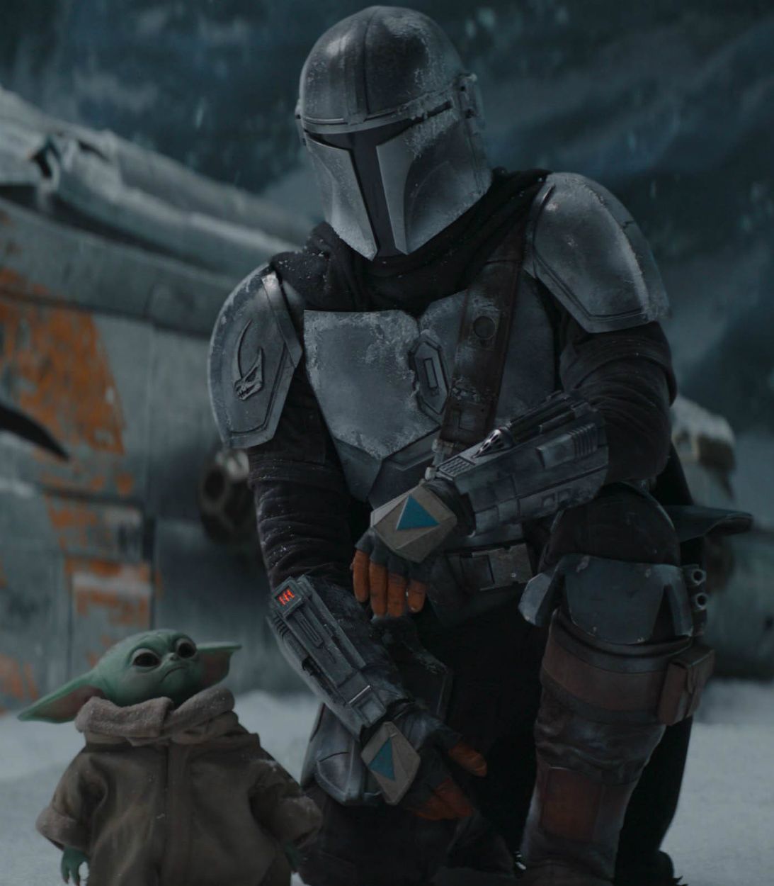 Pedro Pascal as Din Djarin with Baby Yoda in The Mandalorian Season 2 Vertical