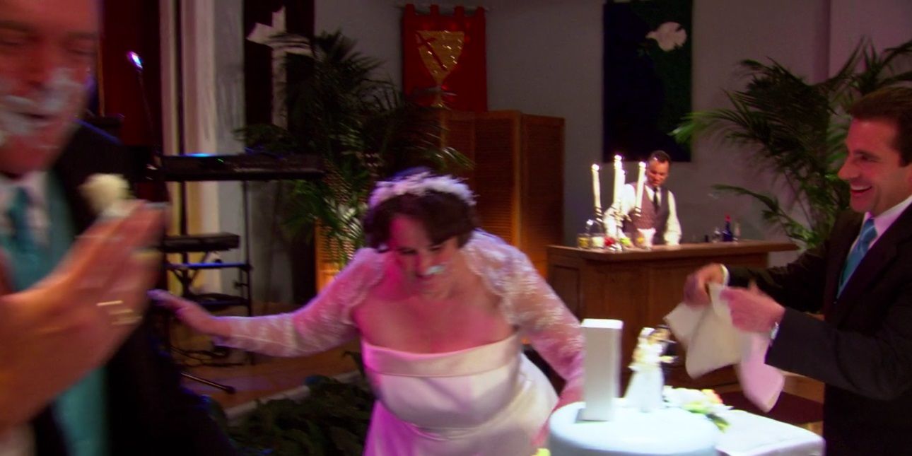 Phyllis and Bob cut the cake in The Office episode 'Phyllis' Wedding'