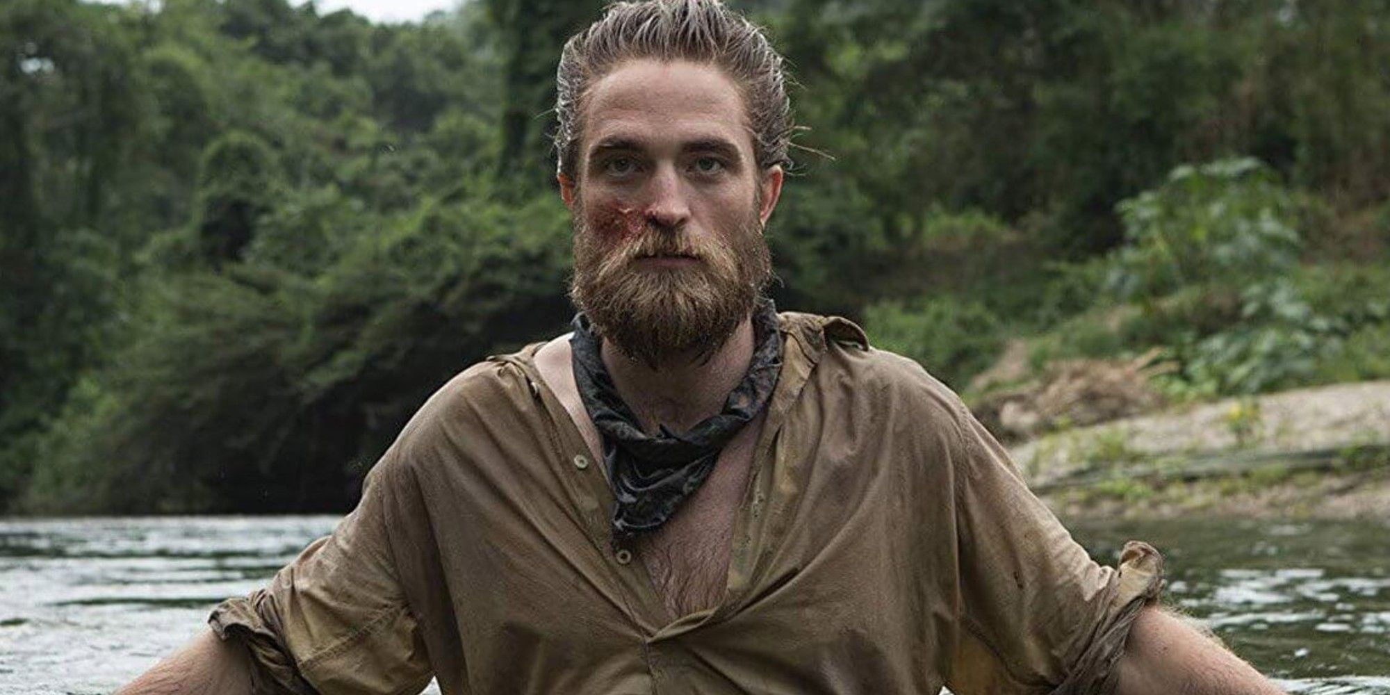 Henry Costin in a river in The Lost City of Z