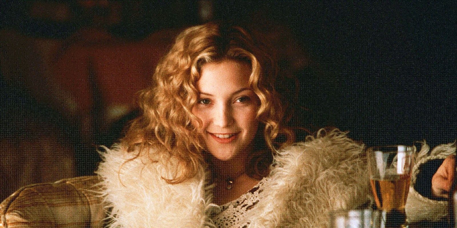 Penny Lane looks on in a fur coat from Almost Famous