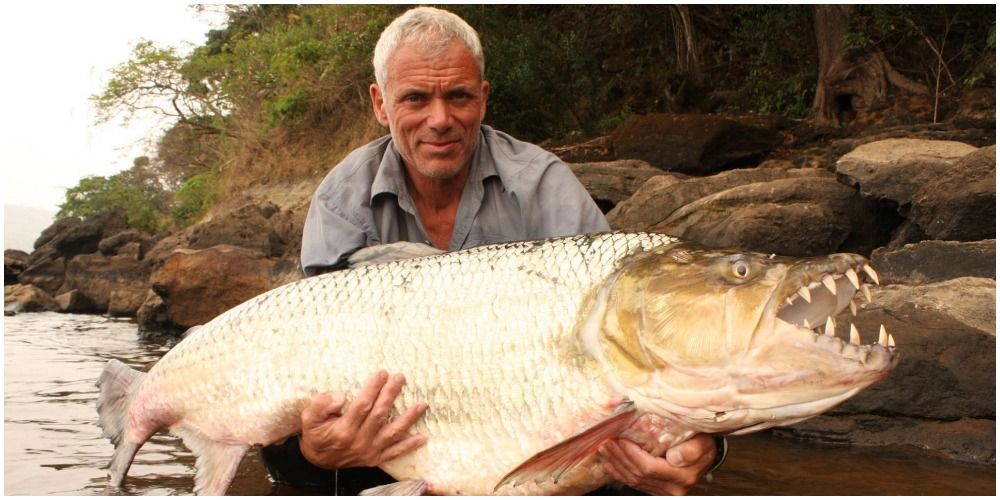 Jeremy Wade holding a giant fish in River Monsters