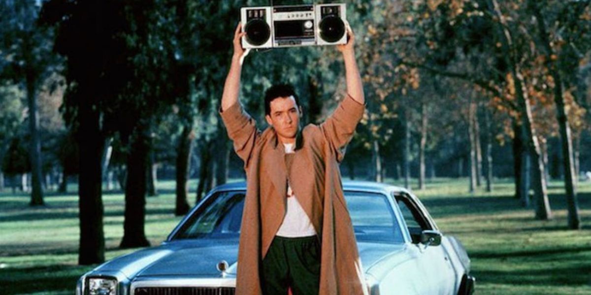 Lloyd stands with a boombox over his head from Say Anything 