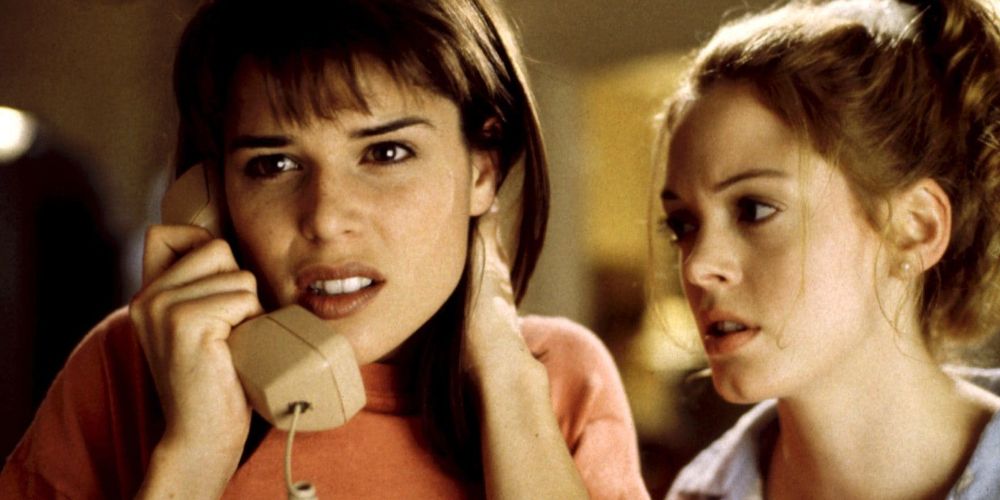 Sydney on the phone with Paige beside her in Scream (1996).