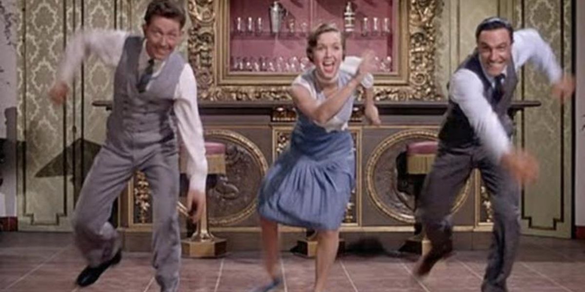 Gene Kelly, Debbie Reynolds, and Donald O'Conner dancing in Singin' In The Rain (1952)
