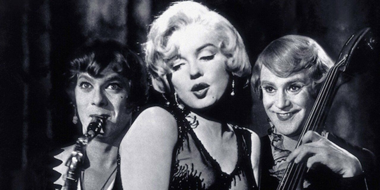 Marilyn Monroe sings as two men dressed as females play behind her in Some Like It Hot.