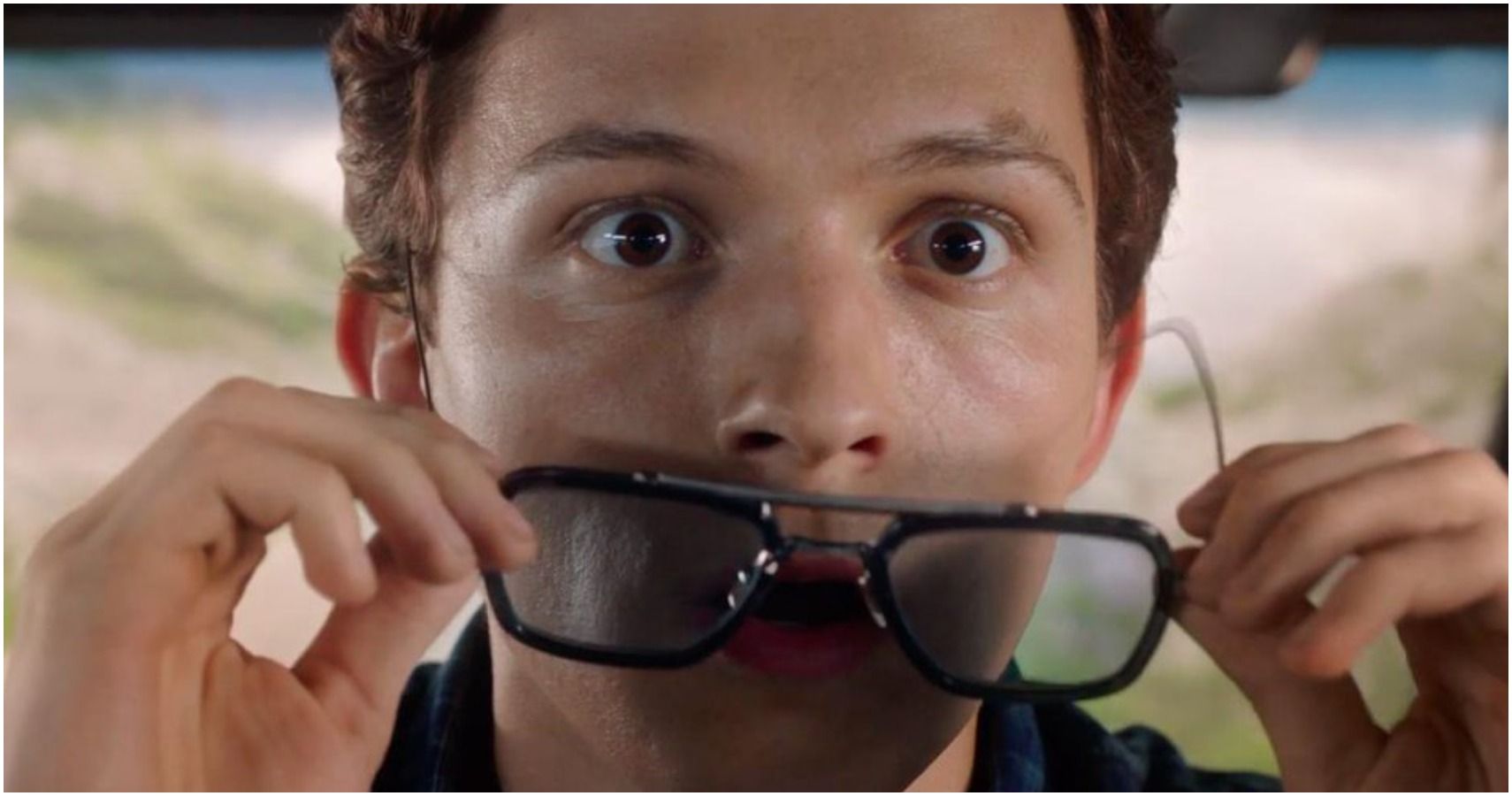 A screenshot of Peter stunned at an incoming drone strike in Spider-Man: Far From Home
