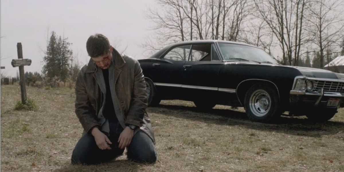 Dean sits alone, mourning Sam after he jumps in the pit with Lucifer in Supernatural