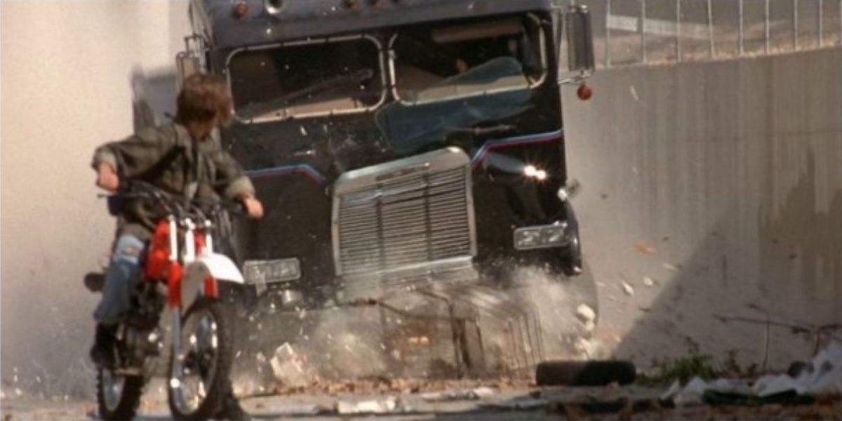 A semi truck chases after John Conner from Terminator 2