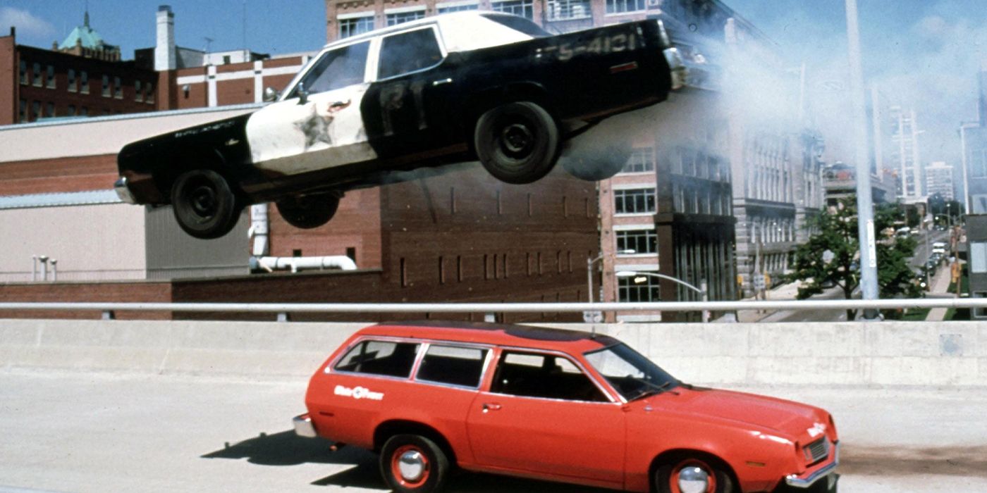 The blues mobile leaps over another car from The Blues Brothers