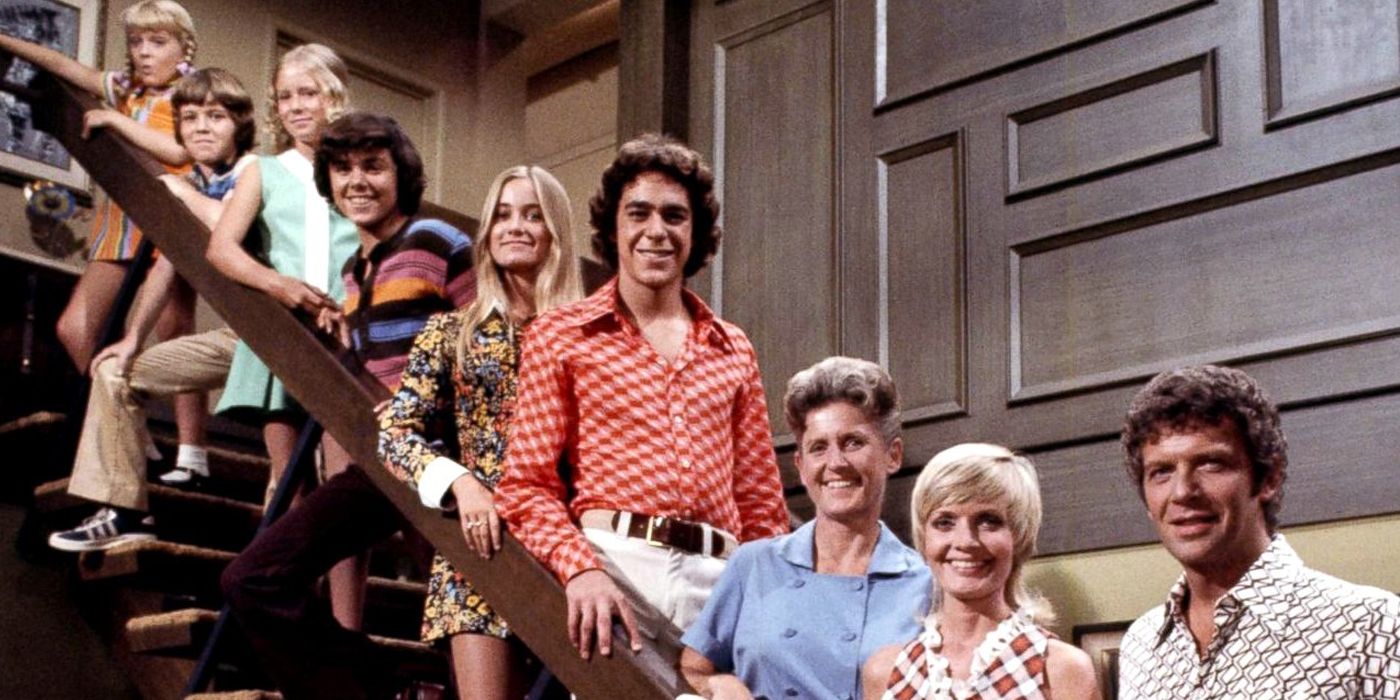 The Brady Bunch family on the staircase