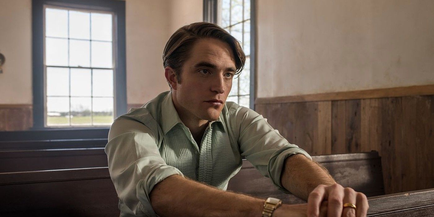 Robert Pattinson sitting in a church in The Devil All The Time.