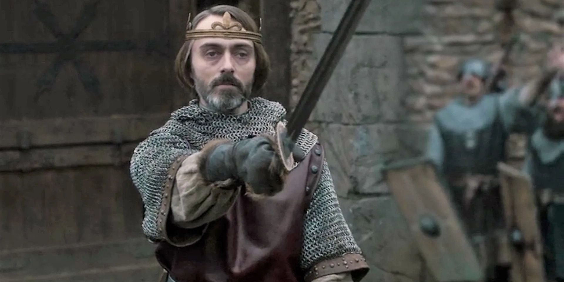 King Alfred pointing a sword in The Last Kingdom.