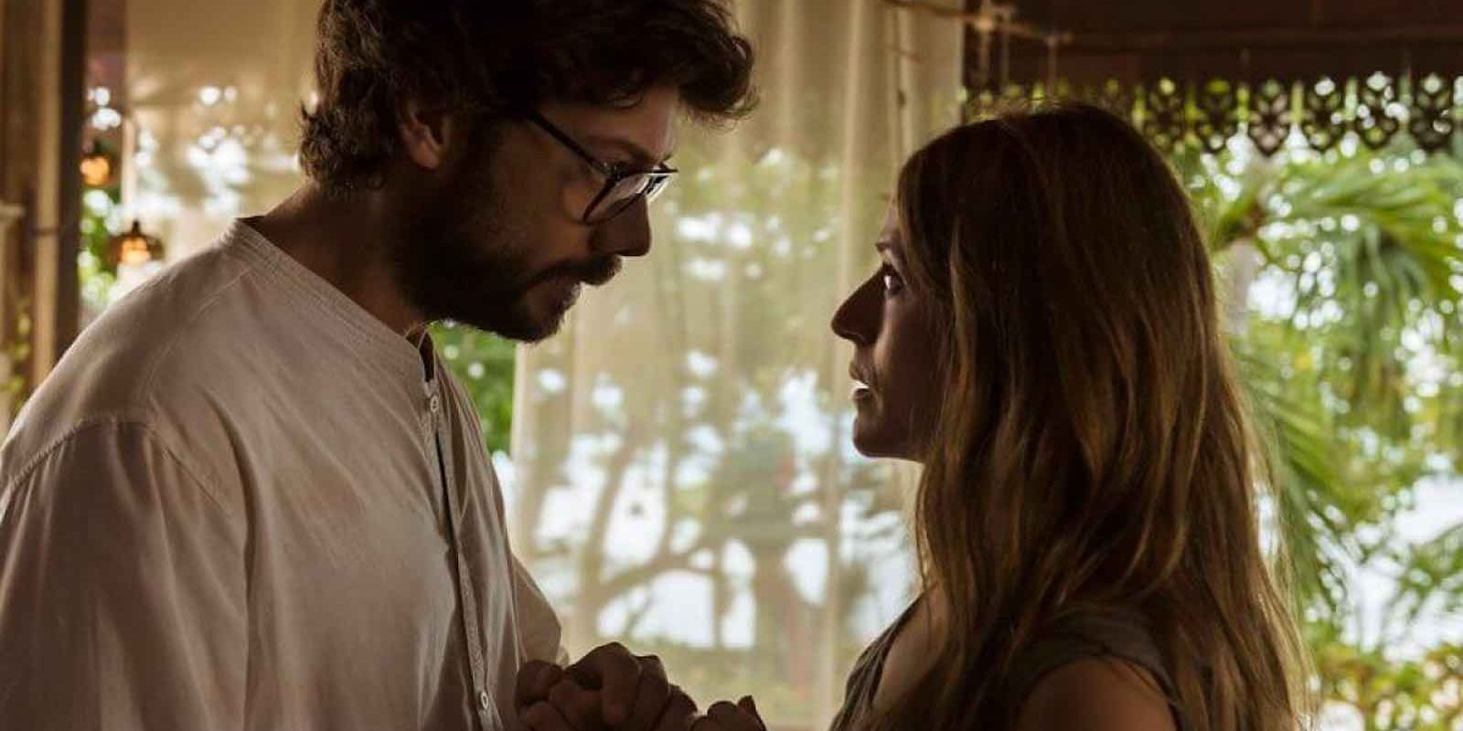 Sergio Marquina and Raquel Murillo as Professor and Lisbon holding hands in Money Heist