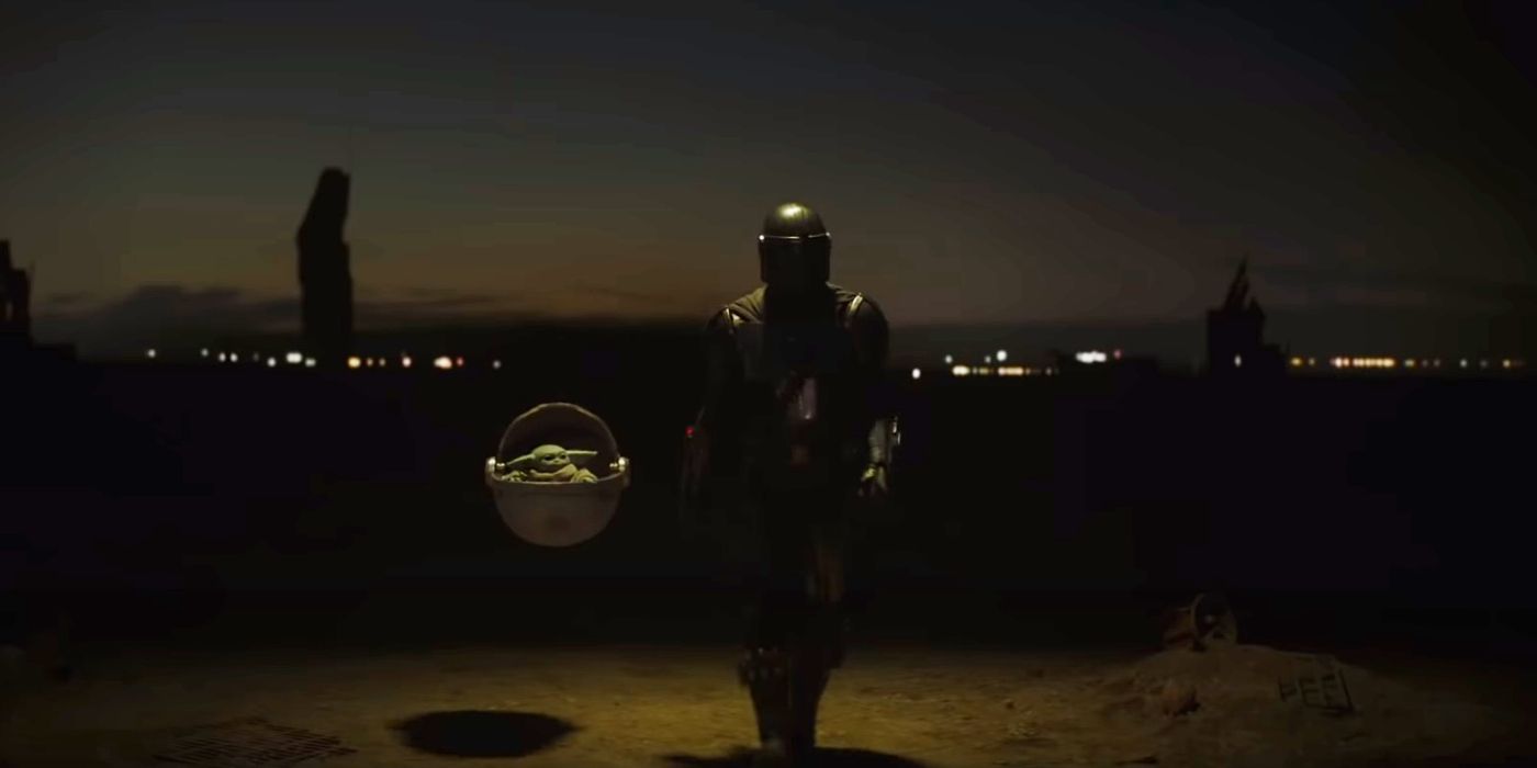 Mando walks with Grogu at his side in The Mandalorian