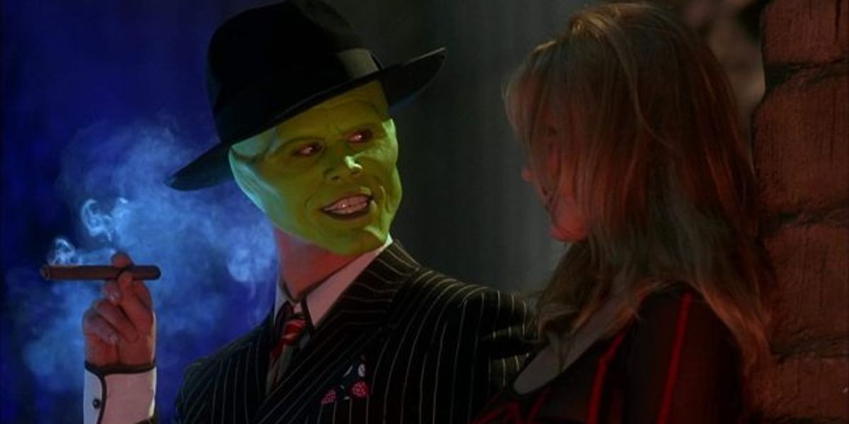 The Mask (Jim Carrey) talking to a tied up Tina in The Mask