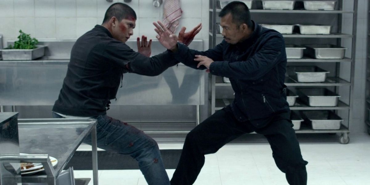 Rama and the Assassin fight in a kitchen in The Raid 2